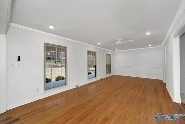 unfurnished room with crown molding, ceiling fan, and hardwood / wood-style floors