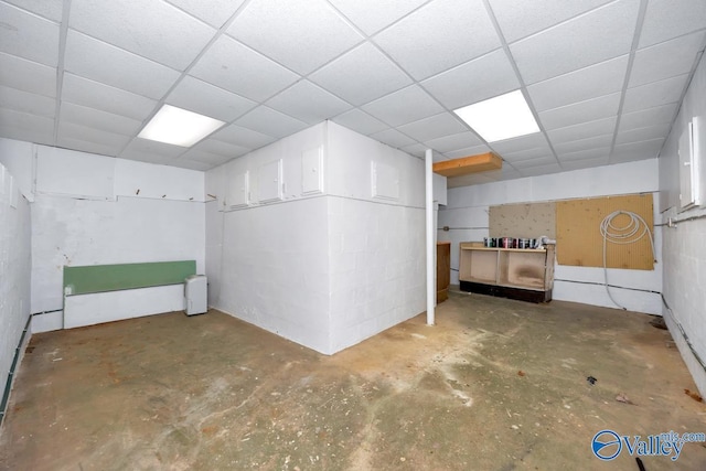 basement featuring a drop ceiling