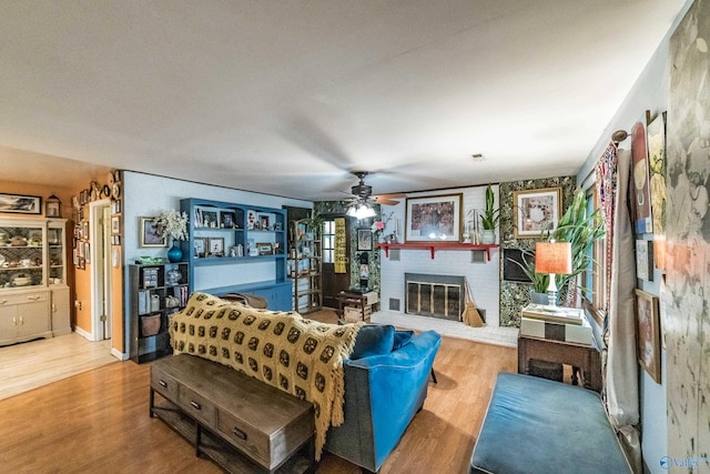 2122 Fernbrook Dr NE, Huntsville, AL 35811 - living area featuring a brick fireplace, wood finished floors, and ceiling fan