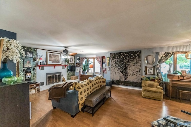 2122 Fernbrook Dr NE, Huntsville, AL 35811 - living room with a ceiling fan, a fireplace, and wood finished floors