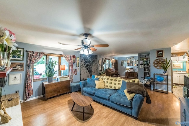 2122 Fernbrook Dr NE, Huntsville, AL 35811 - living area featuring wood finished floors, ceiling fan, and baseboards
