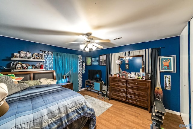 2122 Fernbrook Dr NE, Huntsville, AL 35811 - bedroom featuring wood finished floors, baseboards, and ceiling fan