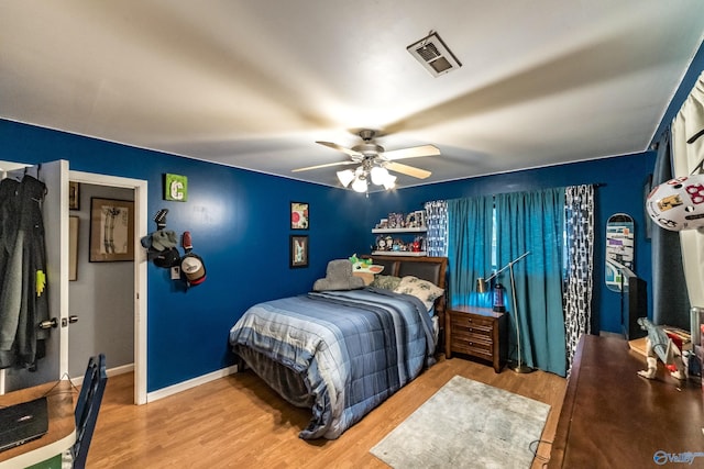 2122 Fernbrook Dr NE, Huntsville, AL 35811 - bedroom featuring wood finished floors, ceiling fan, and baseboards