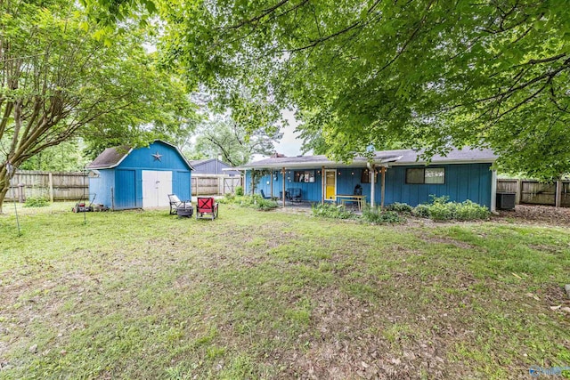 2122 Fernbrook Dr NE, Huntsville, AL 35811 - view of yard with a storage shed, an outdoor structure, and covered porch