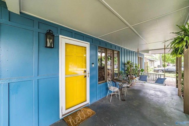 2122 Fernbrook Dr NE, Huntsville, AL 35811 - entrance to property featuring a porch and board and batten siding