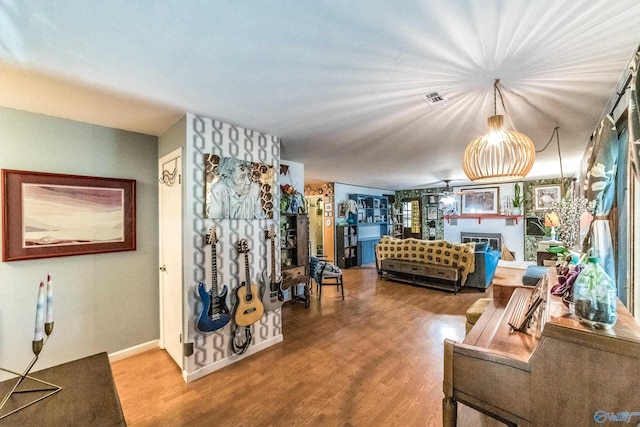 2122 Fernbrook Dr NE, Huntsville, AL 35811 - living area featuring wood finished floors, a fireplace, and baseboards