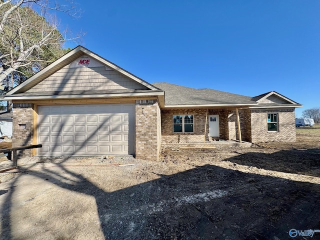 ranch-style house with brick siding and an attached garage