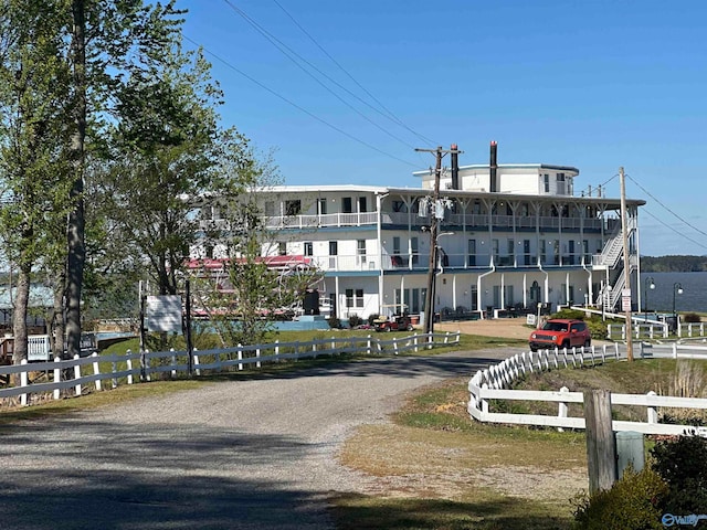 back of house with a balcony