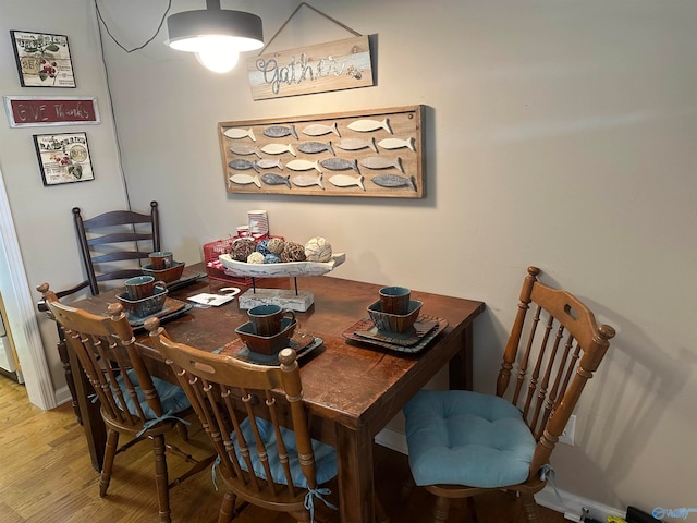 dining room with hardwood / wood-style floors