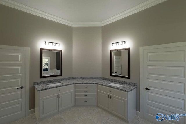 bathroom featuring tile patterned floors, vanity, and crown molding