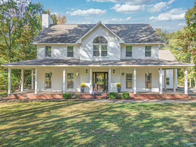 4409 Dogwood Dr, Decatur, AL 35603 - farmhouse featuring a chimney, a front yard, and covered porch