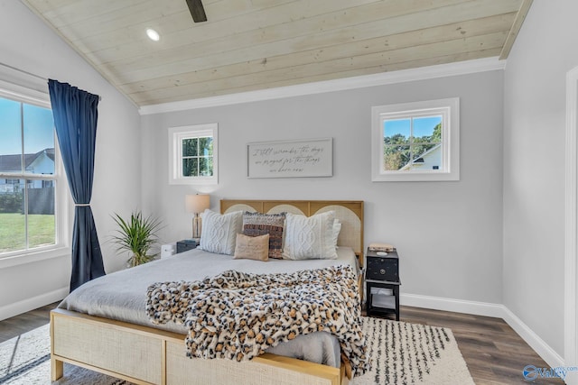 bedroom featuring ornamental molding, dark wood-type flooring, and wooden ceiling