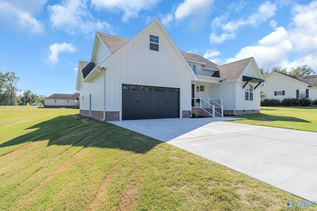 modern farmhouse style home with a front yard and a garage