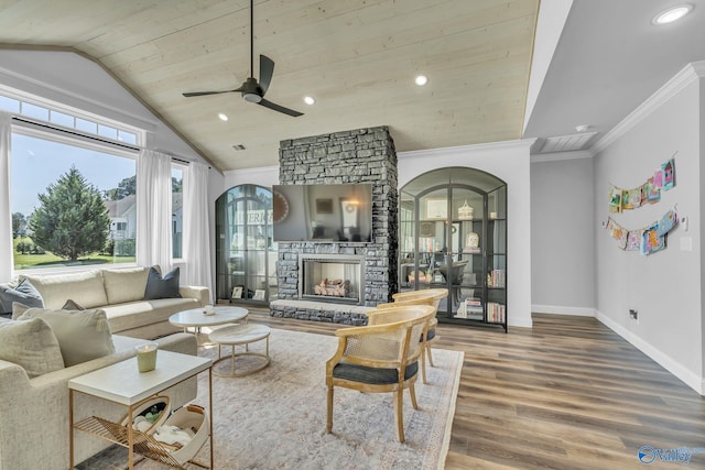 living room featuring wood-type flooring, crown molding, wood ceiling, vaulted ceiling, and a fireplace