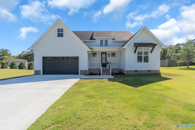 modern farmhouse style home featuring a front yard and covered porch