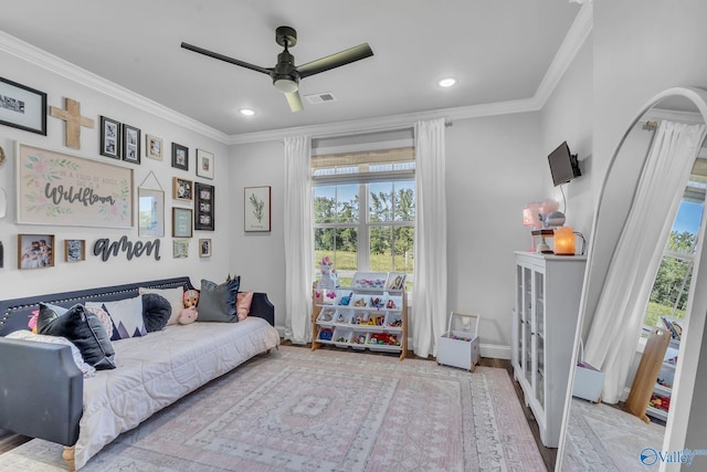 interior space featuring ornamental molding, ceiling fan, plenty of natural light, and light hardwood / wood-style floors