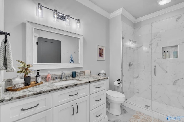 bathroom with crown molding, vanity, toilet, and a shower with shower door