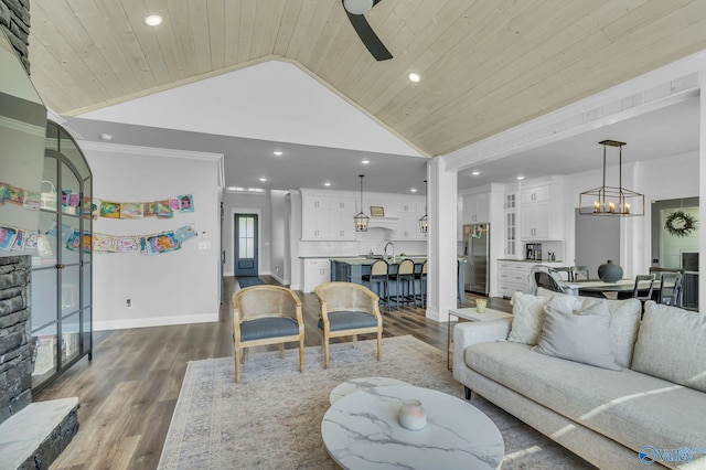 living room featuring ceiling fan with notable chandelier, a healthy amount of sunlight, wooden ceiling, and dark hardwood / wood-style flooring