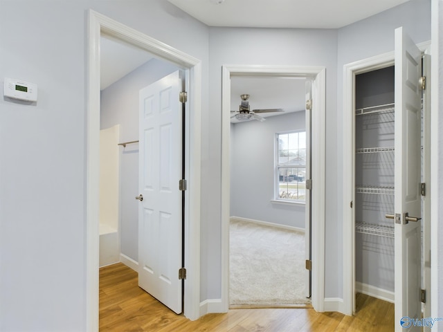 hall with light wood-type flooring