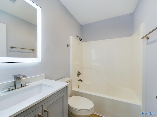 full bathroom featuring vanity, shower / washtub combination, and toilet