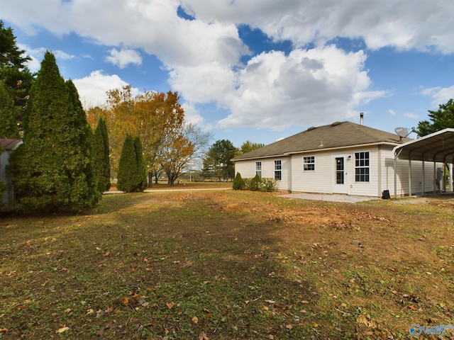 view of yard with a carport