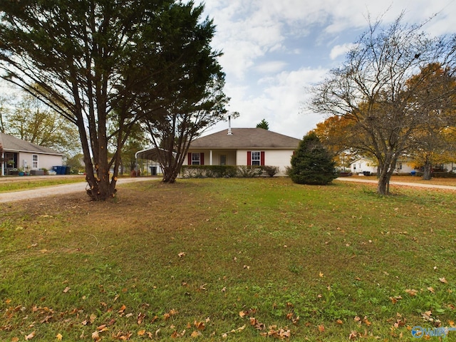 single story home featuring a front lawn