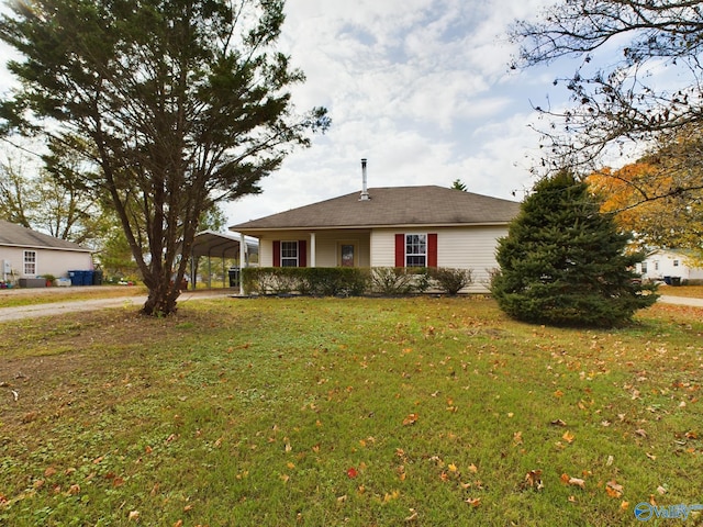 single story home featuring a carport and a front lawn