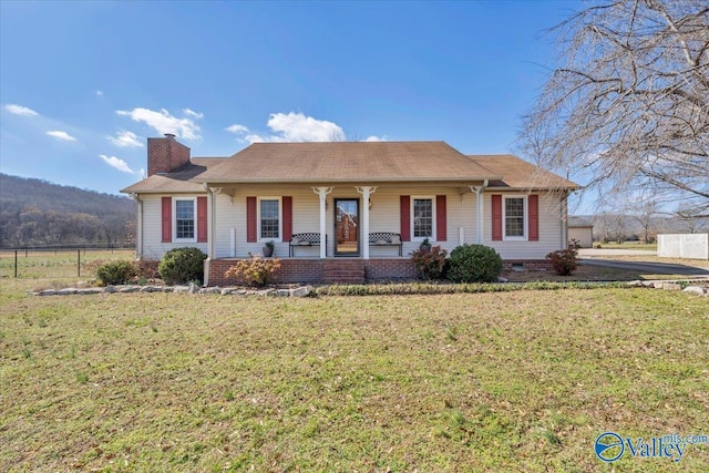 single story home with a porch, crawl space, a chimney, and fence