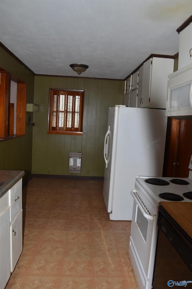 kitchen with heating unit, light floors, crown molding, and white appliances