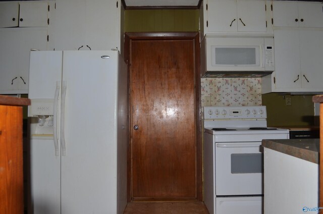 kitchen with white cabinetry and white appliances