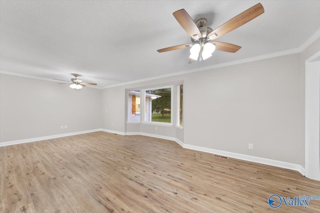 unfurnished room with a textured ceiling, ornamental molding, and light hardwood / wood-style flooring