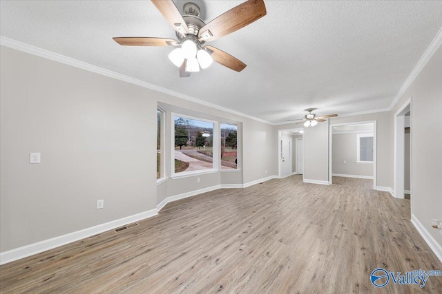 unfurnished living room featuring ceiling fan, a textured ceiling, crown molding, and light wood-type flooring