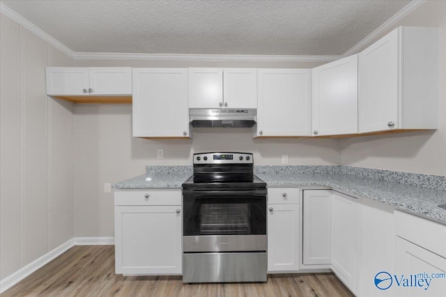 kitchen featuring white cabinetry, crown molding, and electric range