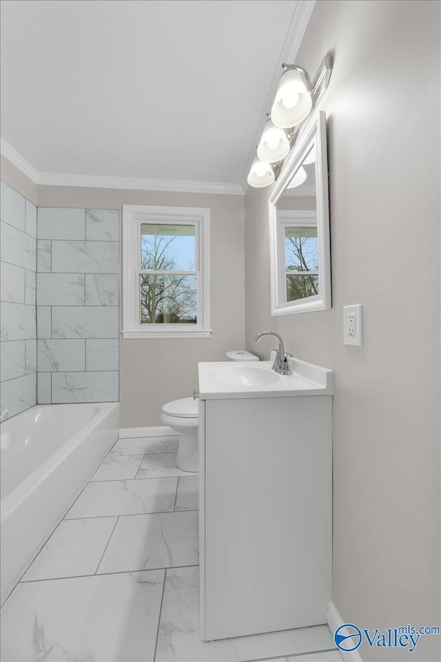 bathroom featuring toilet, a wealth of natural light, ornamental molding, and vanity