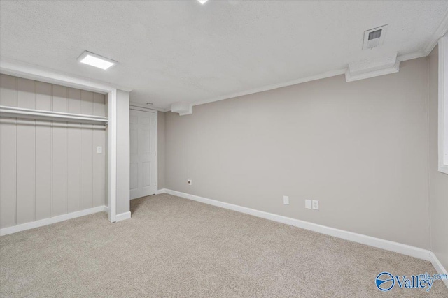 unfurnished bedroom featuring light colored carpet, a closet, and a textured ceiling