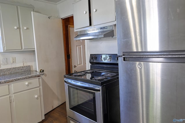 1324 Mckinley Ave NE, Huntsville, AL 35801 - kitchen featuring dark wood-style flooring, white cabinets, appliances with stainless steel finishes, and under cabinet range hood