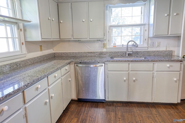 1324 Mckinley Ave NE, Huntsville, AL 35801 - kitchen with a sink, dishwasher, light stone counters, and plenty of natural light