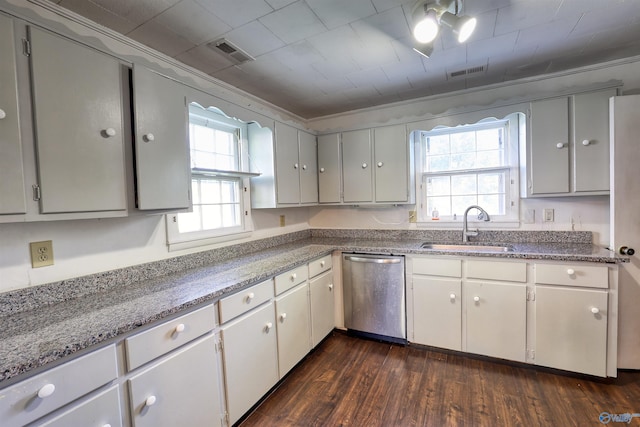 1324 Mckinley Ave NE, Huntsville, AL 35801 - kitchen featuring dark wood finished floors, visible vents, stainless steel dishwasher, and a sink
