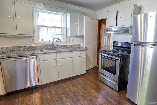1324 Mckinley Ave NE, Huntsville, AL 35801 - kitchen featuring white cabinetry, a sink, appliances with stainless steel finishes, under cabinet range hood, and dark wood finished floors