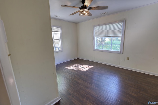 1324 Mckinley Ave NE, Huntsville, AL 35801 - empty room with visible vents, ceiling fan, wood-type flooring, and plenty of natural light