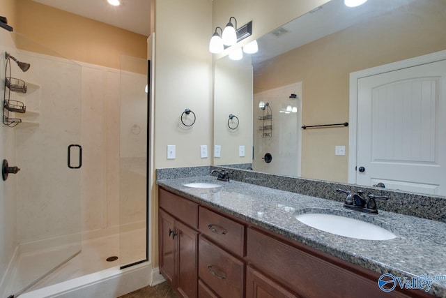 bathroom featuring vanity and an enclosed shower