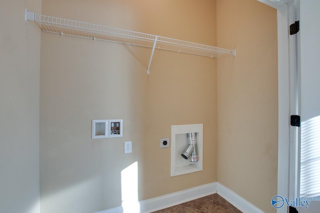 washroom featuring electric dryer hookup, tile patterned flooring, and washer hookup