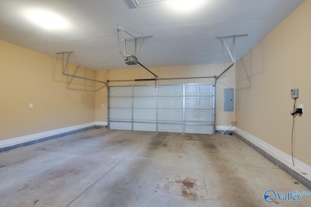 garage featuring electric panel and a garage door opener