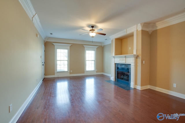 unfurnished living room with ceiling fan, dark hardwood / wood-style flooring, and crown molding