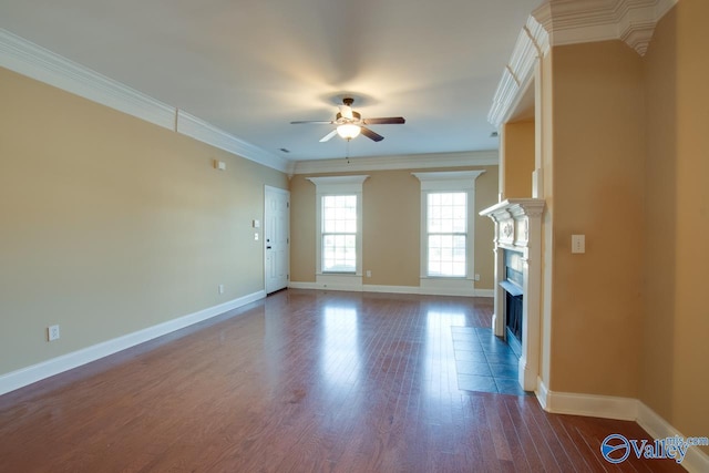 unfurnished living room with ceiling fan, crown molding, wood-type flooring, and a fireplace