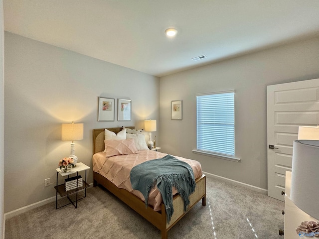 bedroom featuring carpet, visible vents, and baseboards