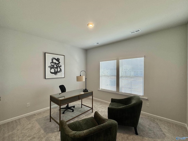 carpeted home office featuring baseboards and visible vents