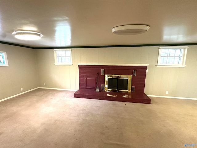 basement with a fireplace and carpet floors