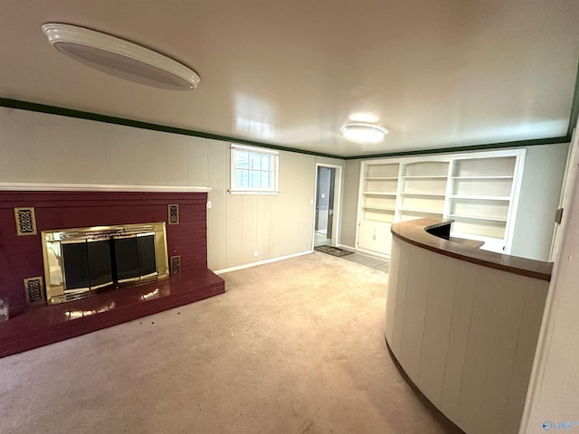 interior space with light colored carpet and a brick fireplace