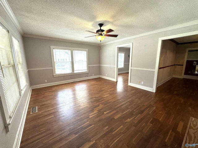 spare room featuring ornamental molding, dark hardwood / wood-style floors, a textured ceiling, and ceiling fan